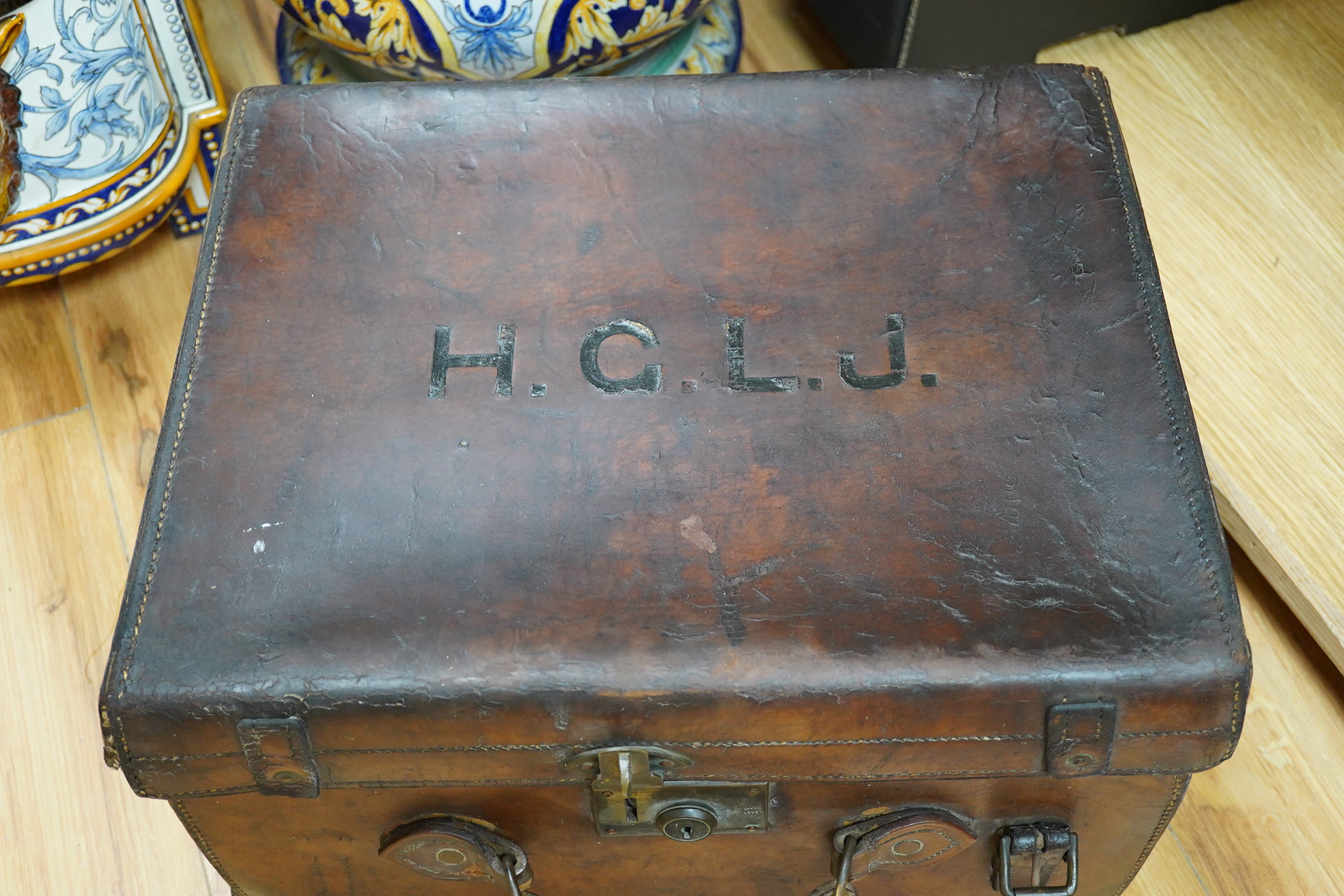 An early 20th century brown leather trunk